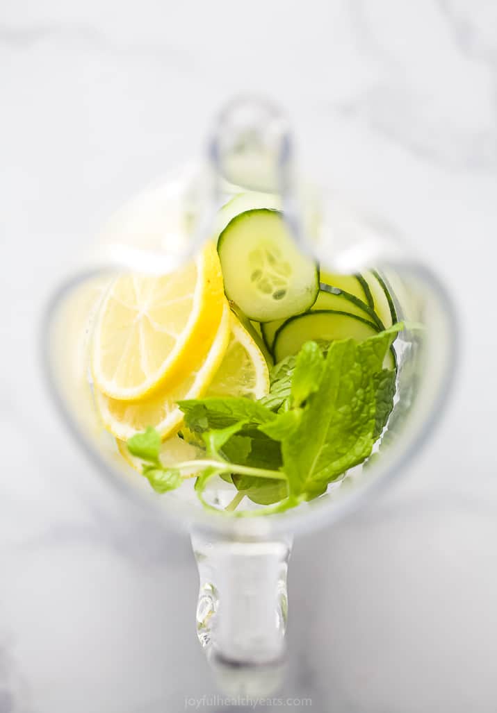 a pitcher filled with cucumber lemon and mint