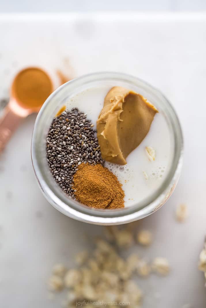 overhead photo of a jar with peanut butter, chia and cinnamon