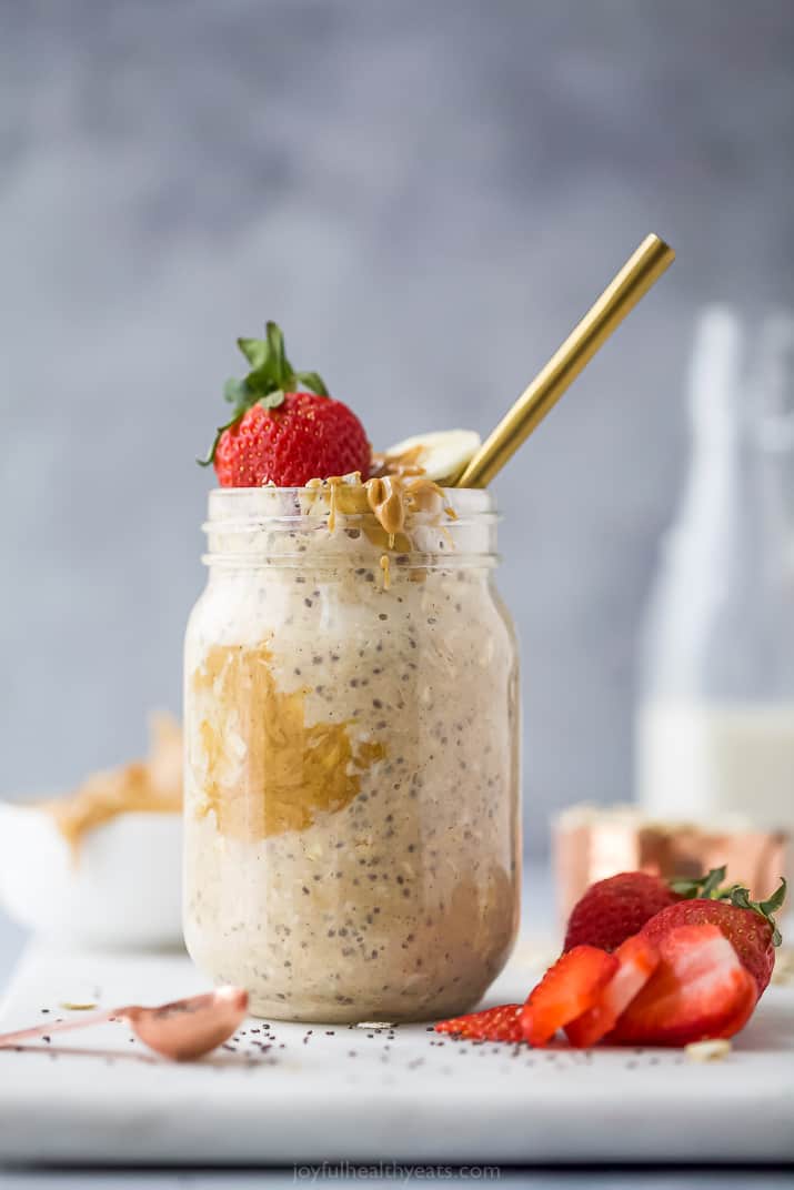 jar filled with oats, peanut butter and berries