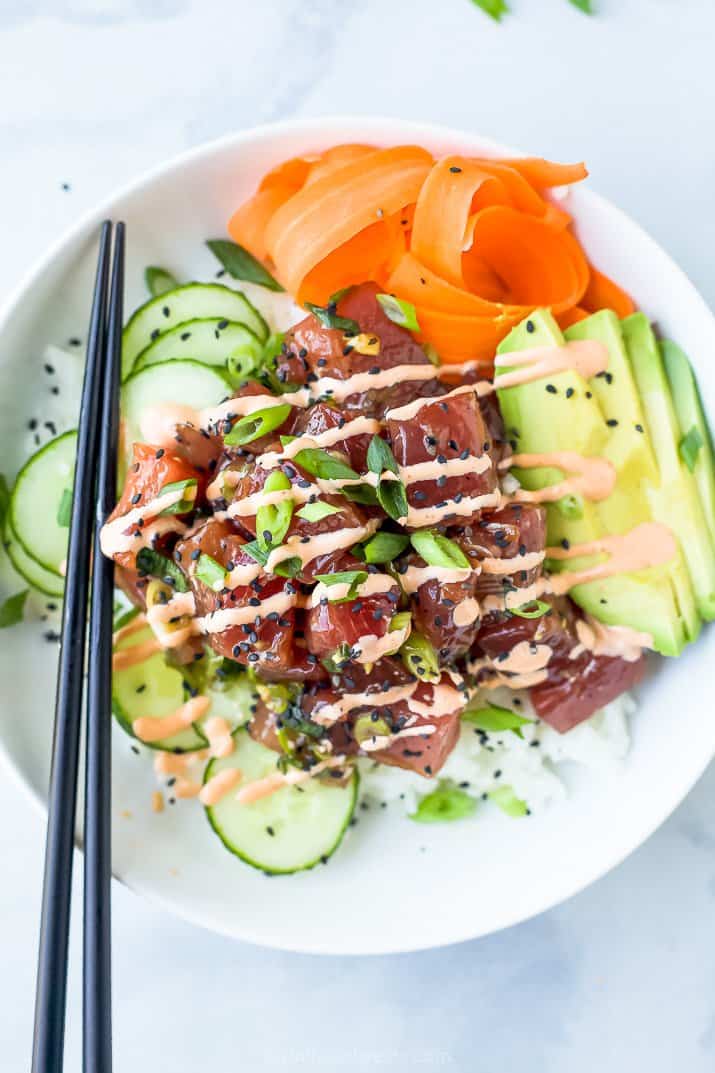 A Tuna Poke Bowl with a Pair of Black Chopsticks Balanced on the Bowl