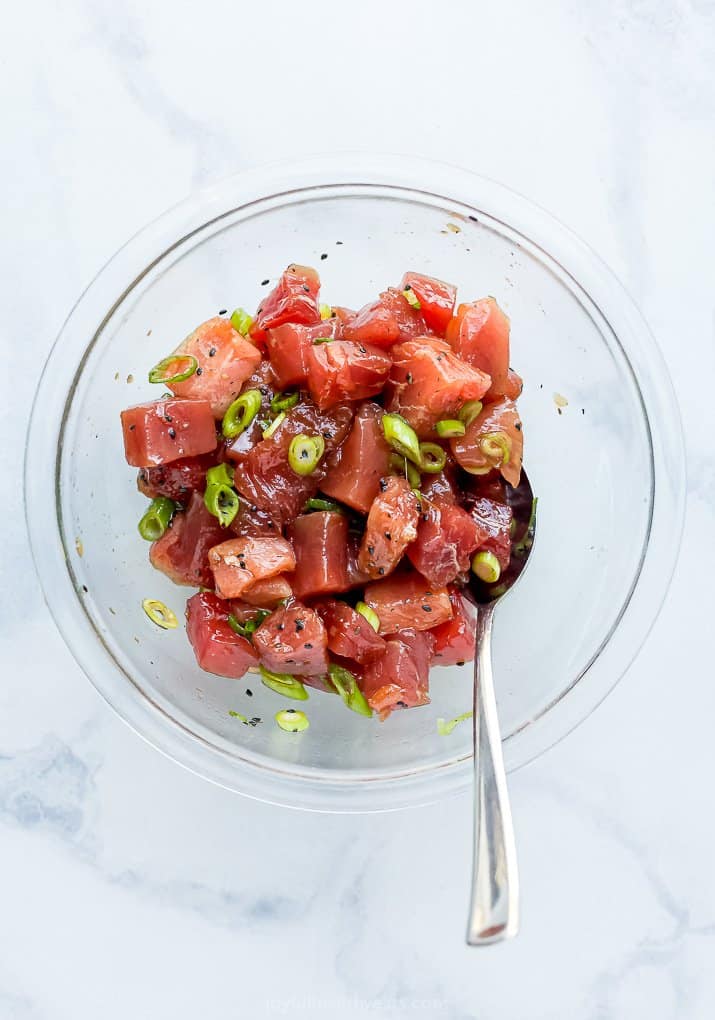 Chunks of Bluefin Tuna Marinating in a Glass Bowl