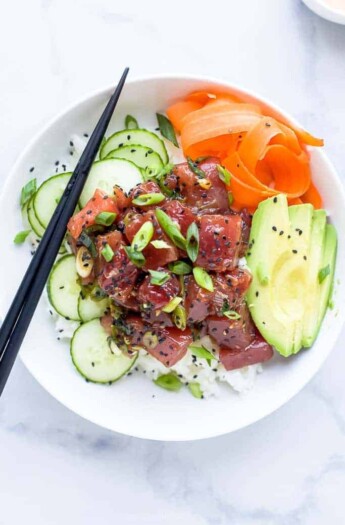 A Hawaiian Poke Bowl Sitting on Top of a Black and White Marble Counter