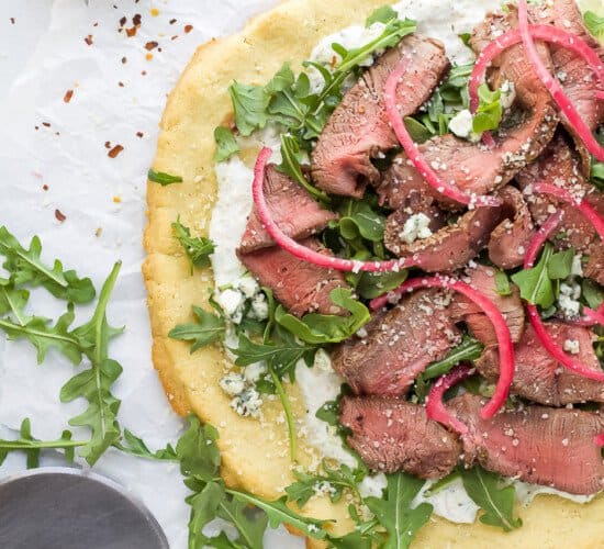 flatbread pizza with steak and arugula