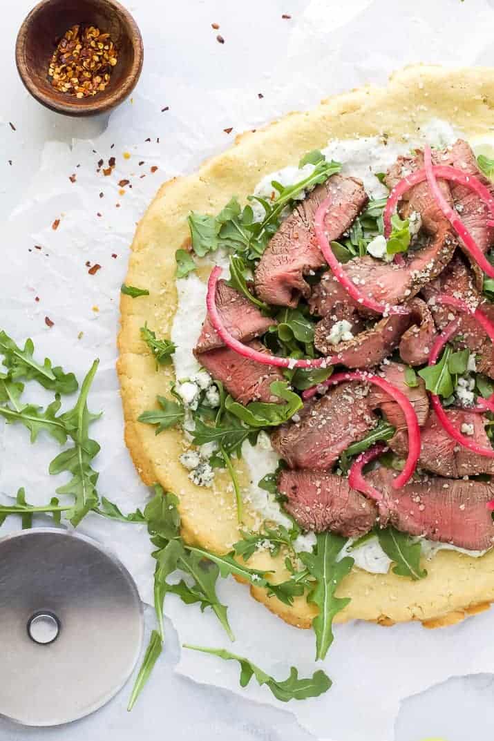 flatbread pizza with steak and arugula