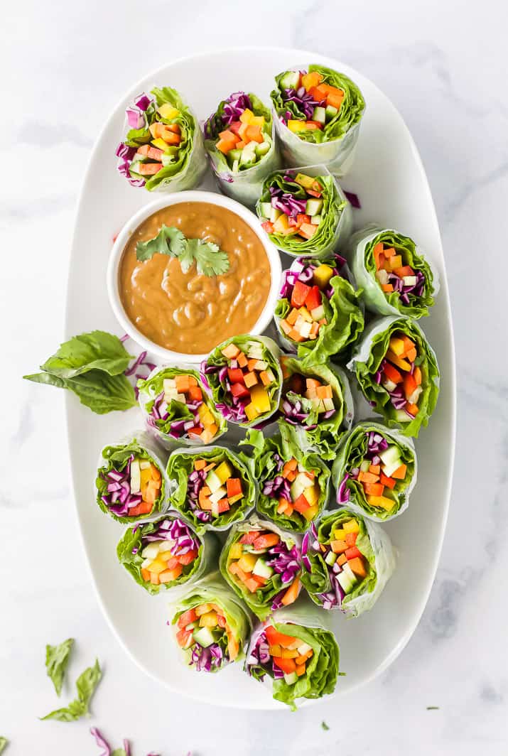 A Wide Platter Holding Fresh Summer Rolls and Spicy Peanut Butter Dip
