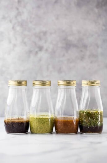 jars filled with homemade salad dressing