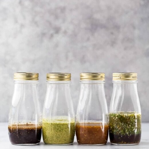 jars filled with homemade salad dressing