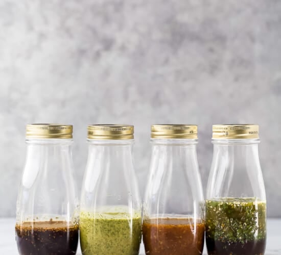 jars filled with homemade salad dressing