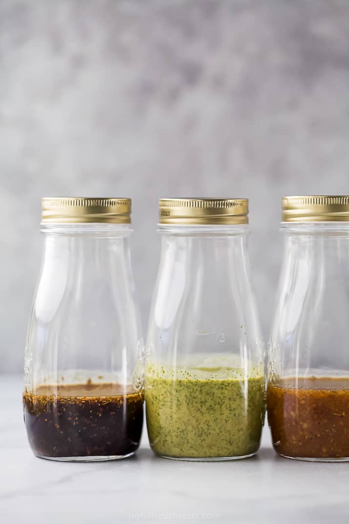 jars with healthy salad dressings