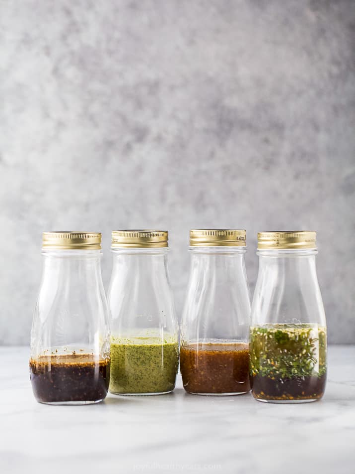 jars filled with homemade salad dressings