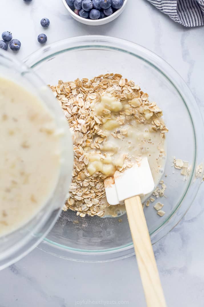 Ingredients of baked oatmeal being mixed together