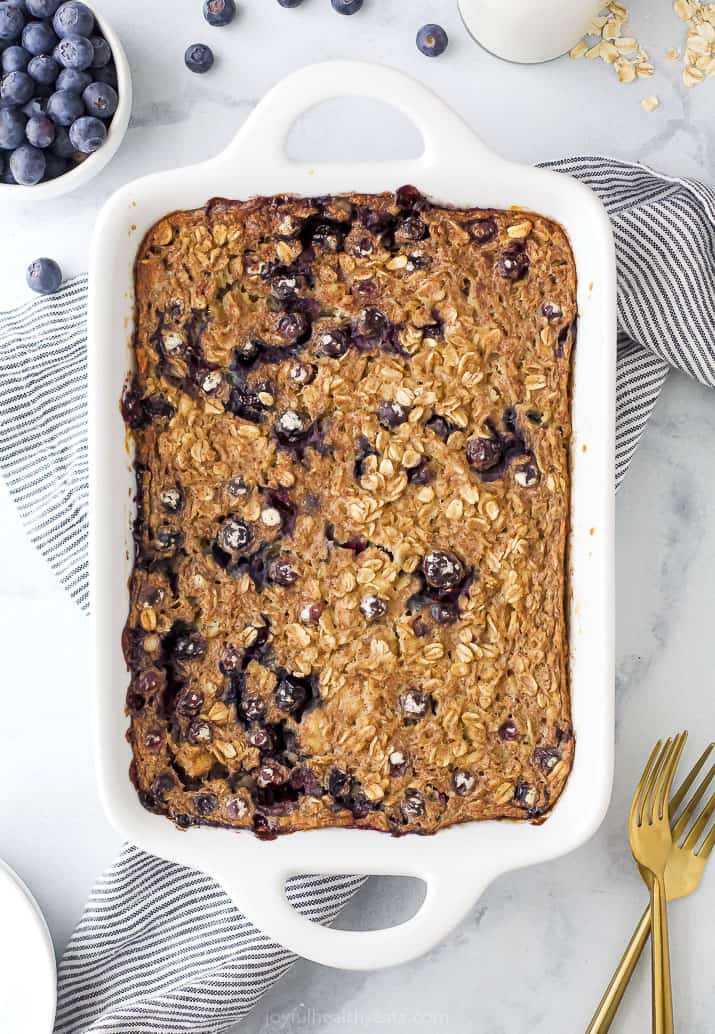 A white baking dish of blueberry baked oatmeal fresh out of the oven