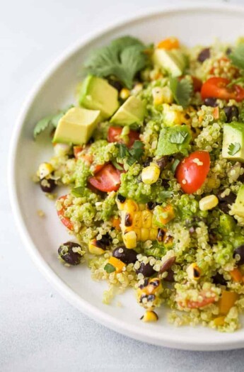 Close-up of a serving of fiesta quinoa topped with avocado pieces