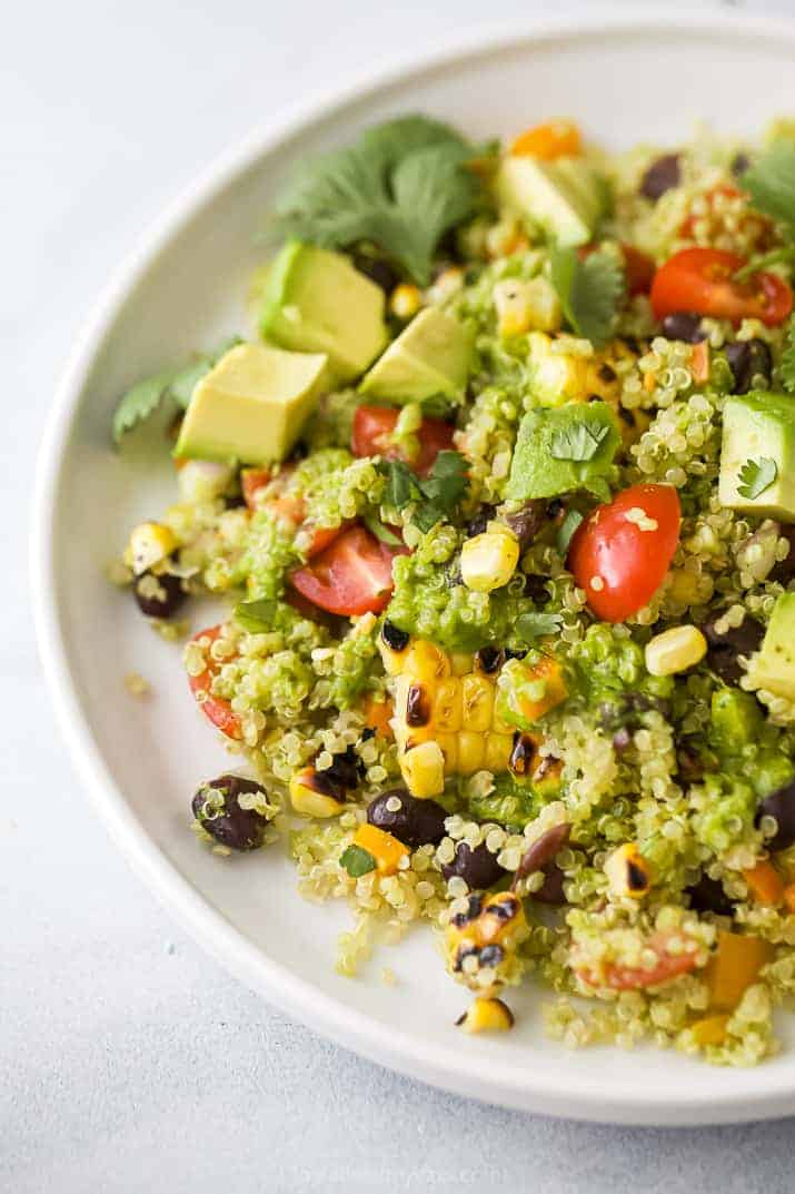 Close-up of a serving of fiesta quinoa topped with avocado pieces