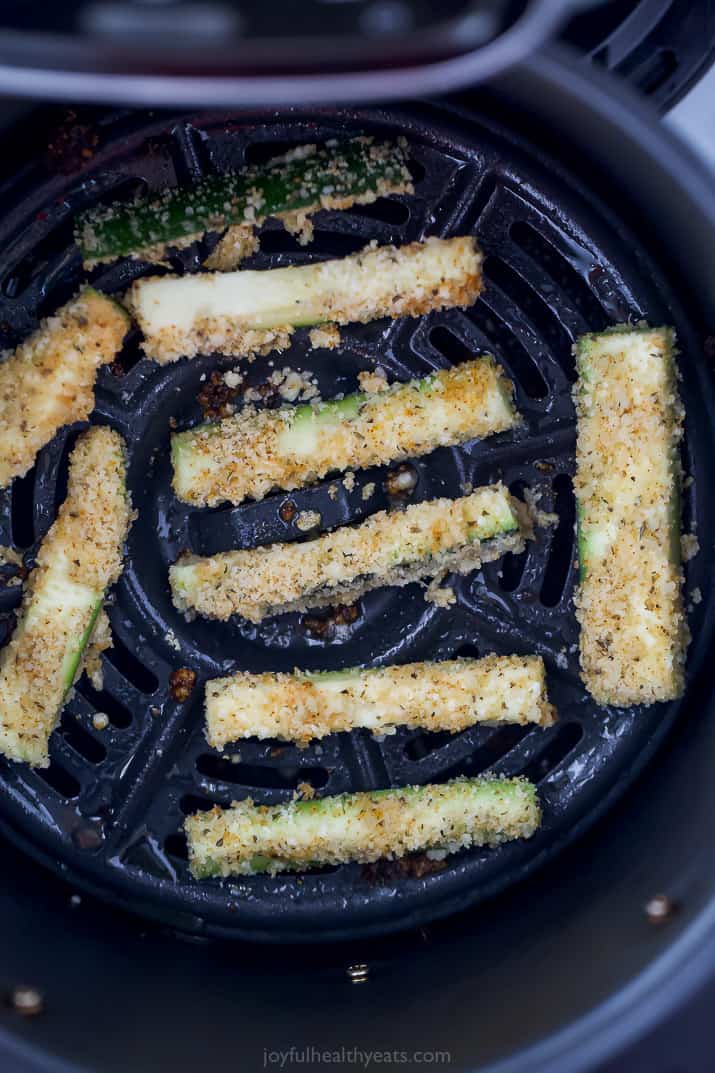 Zucchini fryers in on an air fryer tray