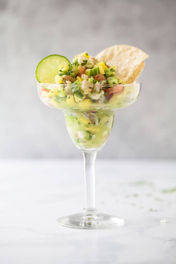 cup filled with shrimp ceviche with avocado