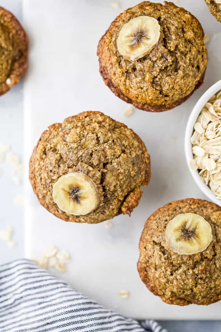 Aerial view of muffins topped with a slice of banana