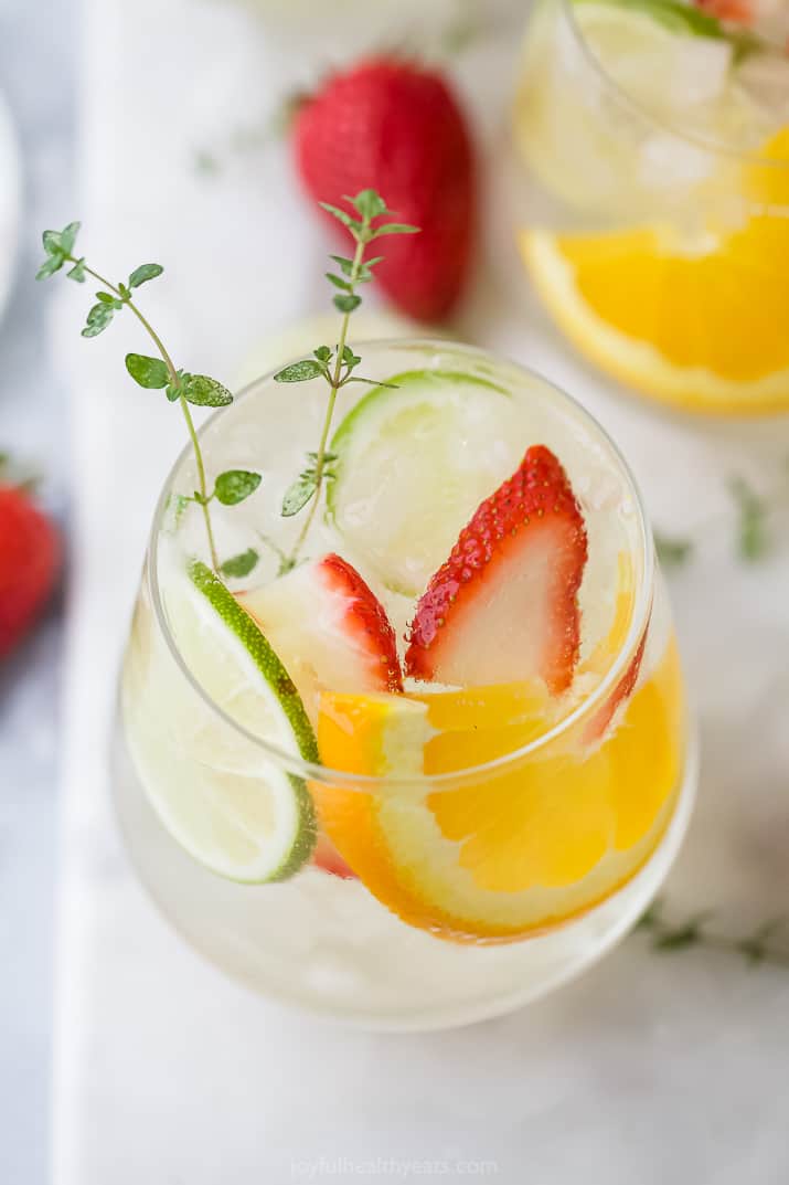 A glass of refreshing citrus white wine spritzer