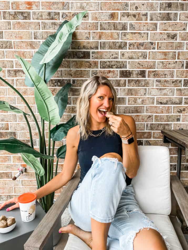 girl eating a bite from daily harvest