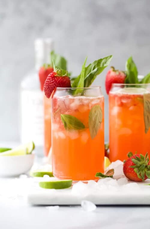 Two glasses with strawberries and vodka