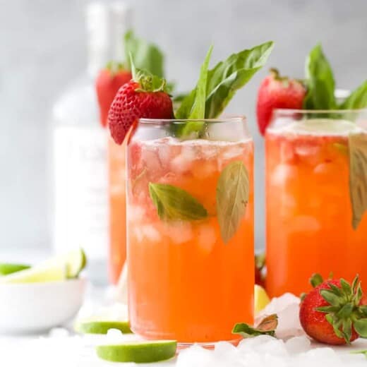 Two glasses with strawberries and vodka