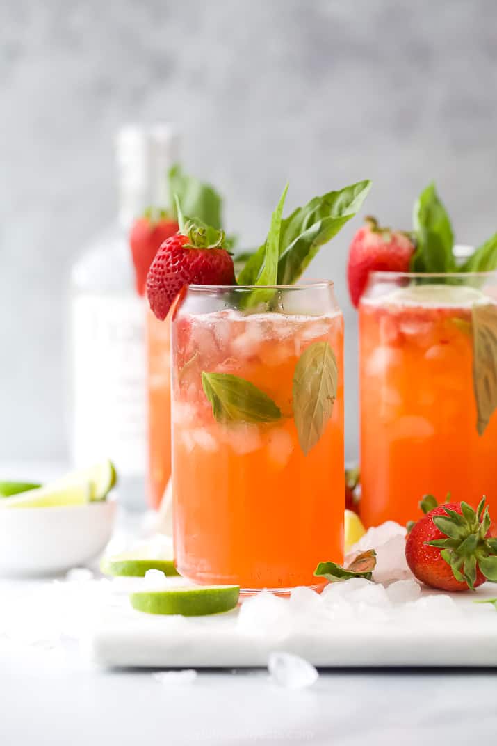 Two glasses with strawberries and vodka