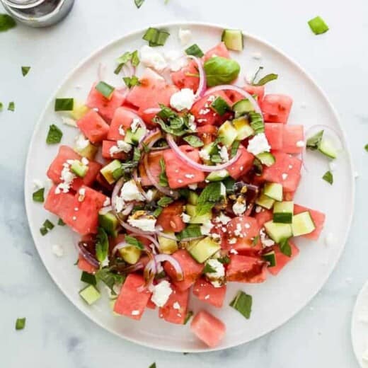 plate filled with watermelon feta salad with cucumber