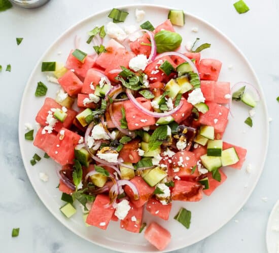 plate filled with watermelon feta salad with cucumber