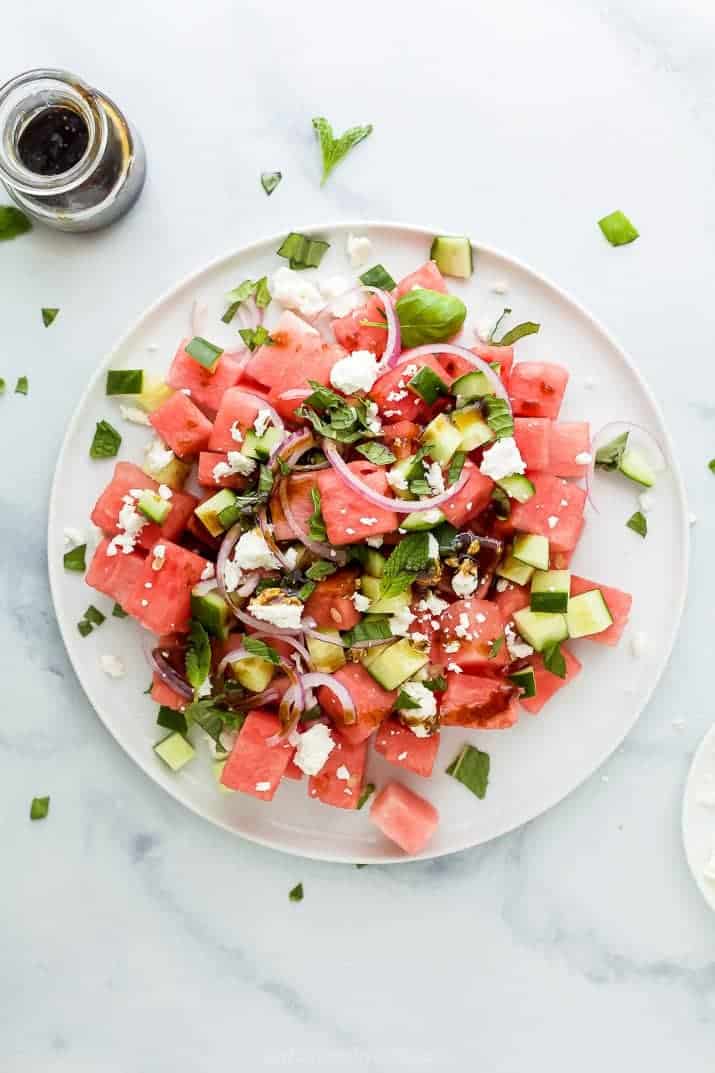 plate filled with watermelon feta salad with cucumber