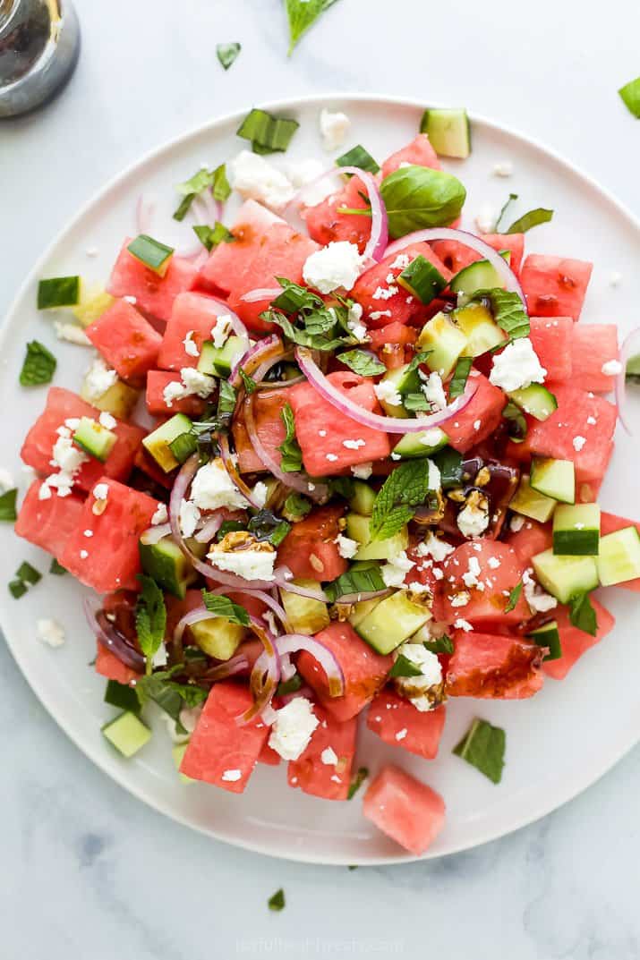 plate filled with watermelon feta mint salad