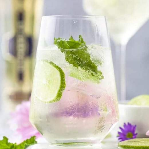 Hugo Cocktail with lime and mint in a large wine glass