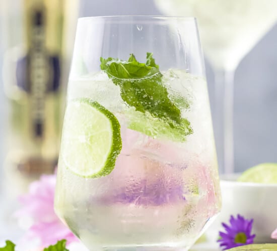 Hugo Cocktail with lime and mint in a large wine glass