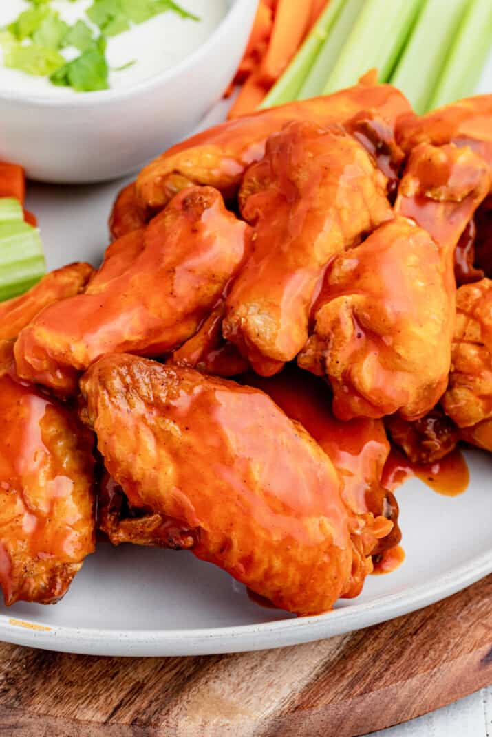 A Close-Up Shot of Spicy Baked Wings on a White Plate