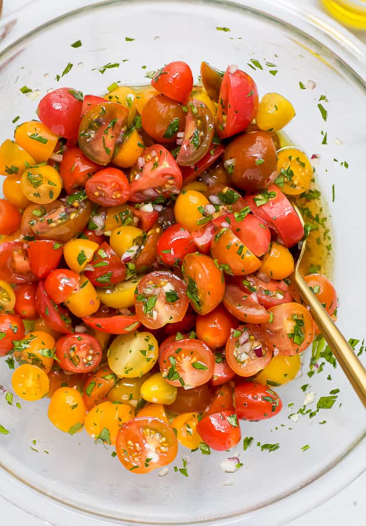 close up of marinated tomato salad in a bowl