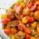 close up of marinated tomato salad in a bowl