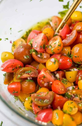 close up of marinated tomato salad in a bowl