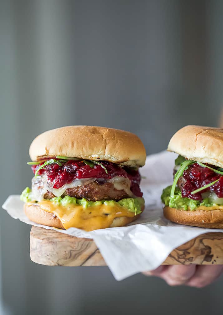 turkey burger with cranberry chutney on a cutting board