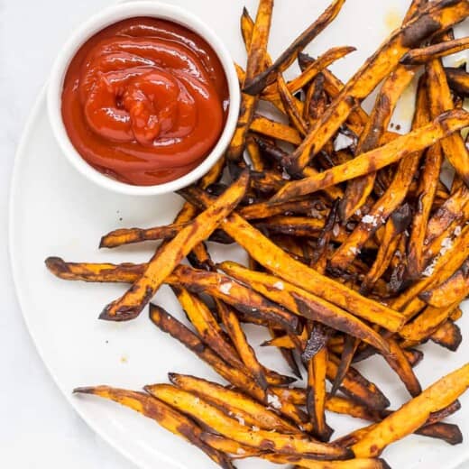 sweet potato fries on a plate with ketchup