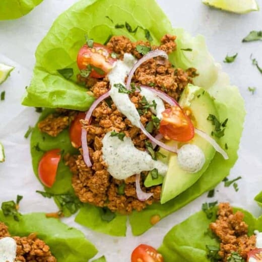 ground turkey taco meat in lettuce wraps with toppings