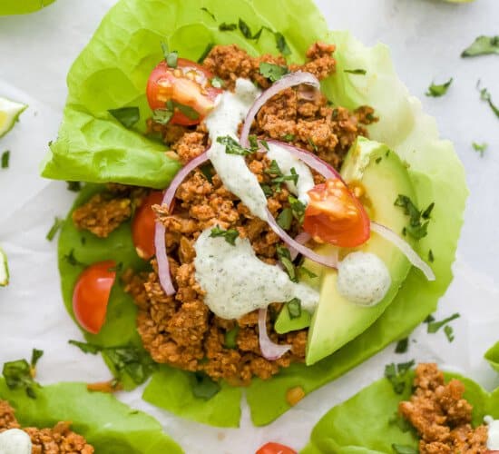 ground turkey taco meat in lettuce wraps with toppings