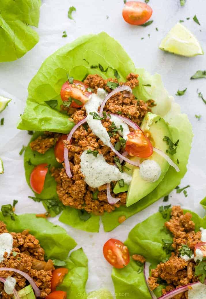 ground turkey taco meat in lettuce wraps with toppings