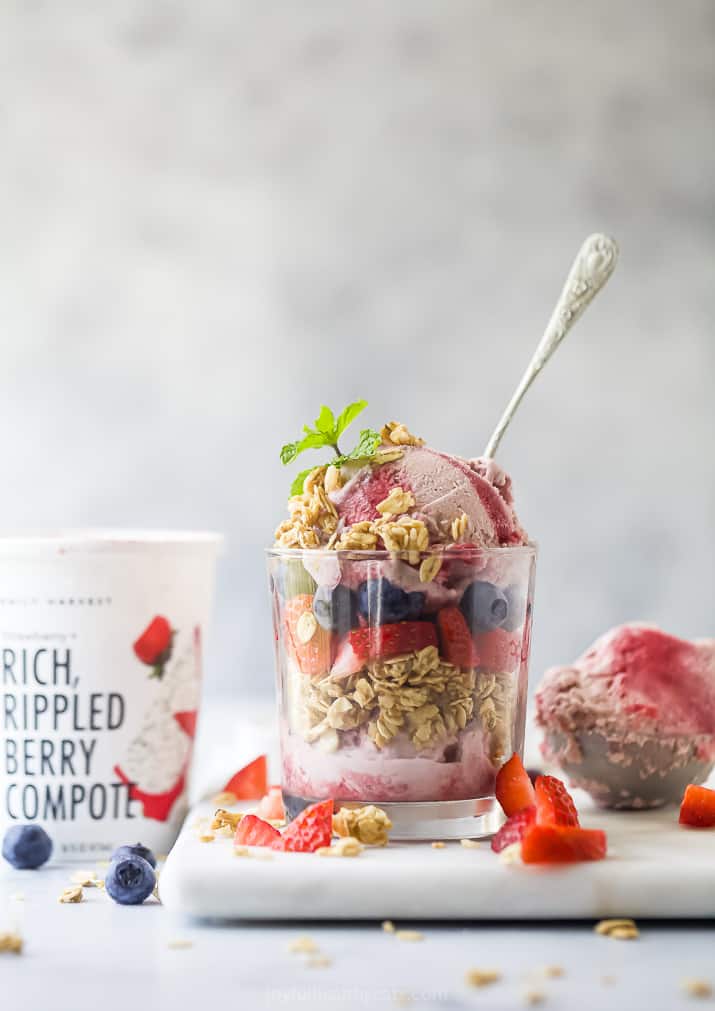A glass filled with Daily Harvest ice cream, granola and fresh fruit