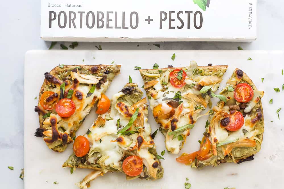 Portobello pesto flatbread pizza on a marble counter.