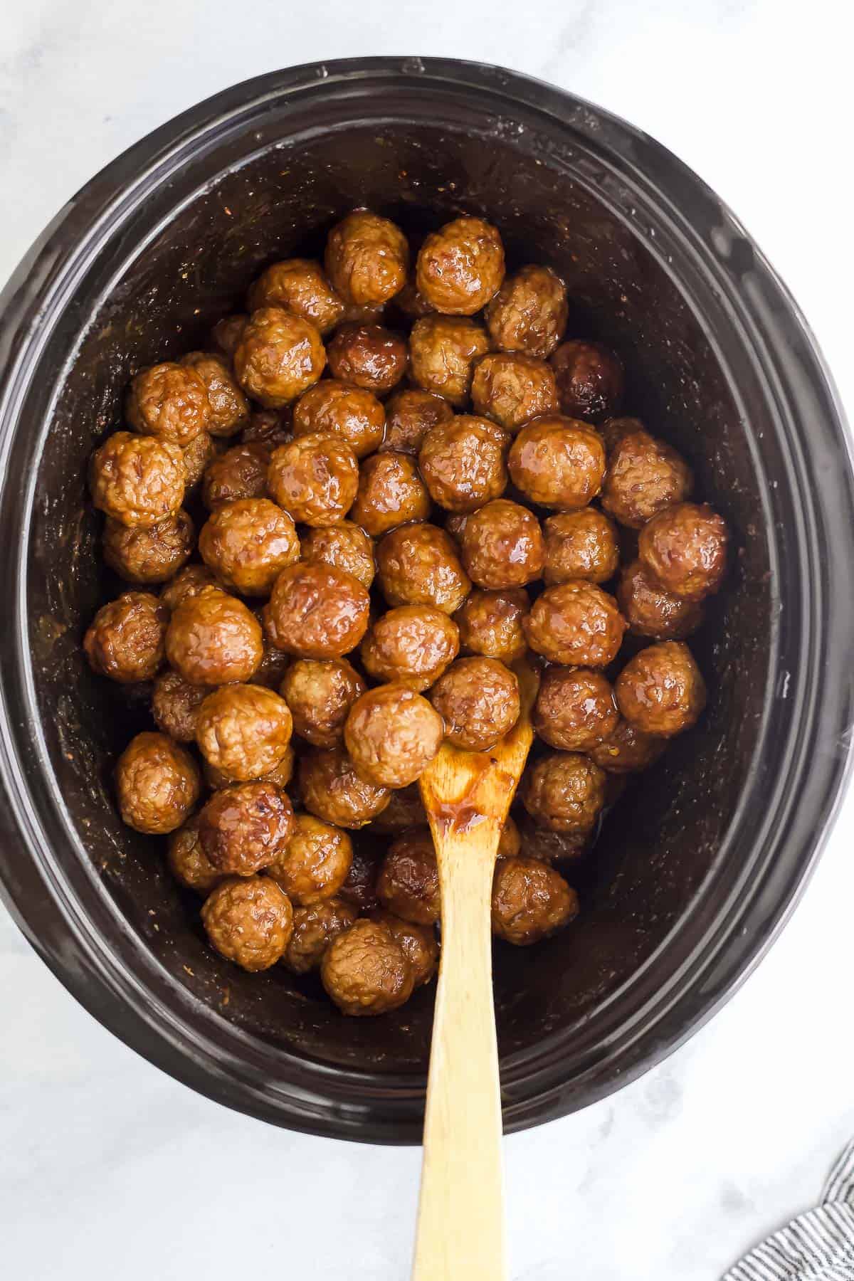 meatballs with an asian sauce in a crockpot