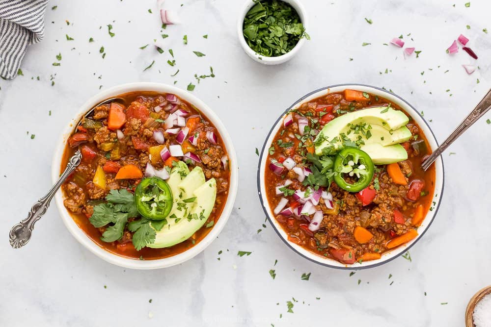 bowl of whole30 beef chili with toppings