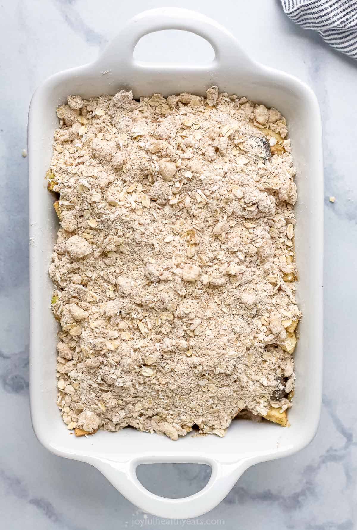 apple blueberry baking dish topped with oat crumble