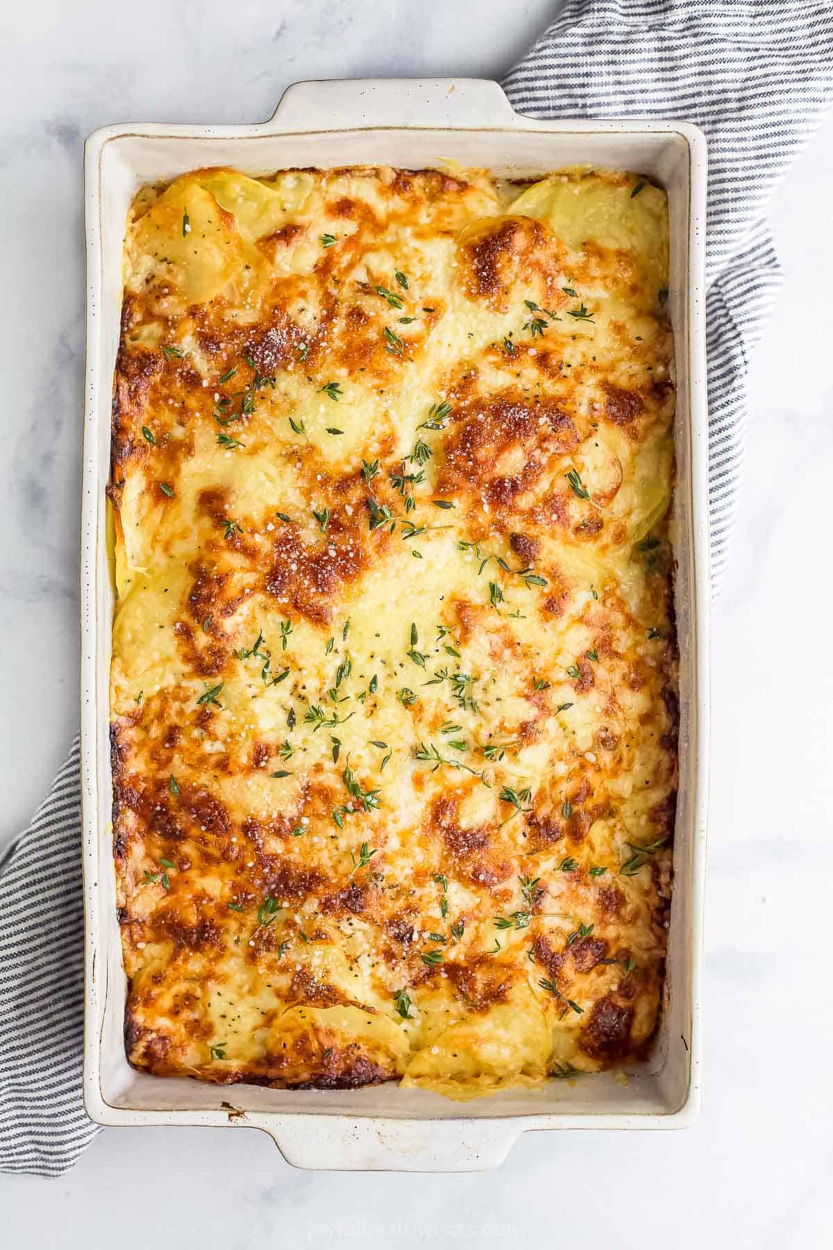 finished cheesy scalloped potatoes in a baking dish