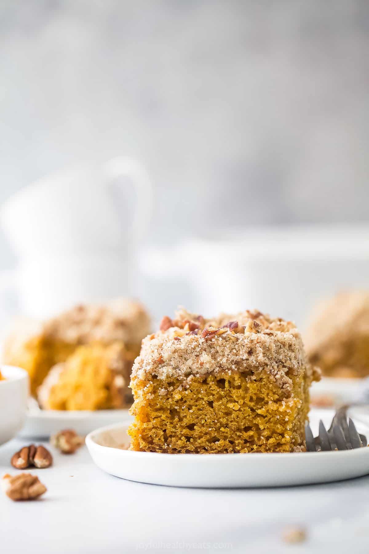 plate with pumpkin spice coffee cake and pecan streusel topping