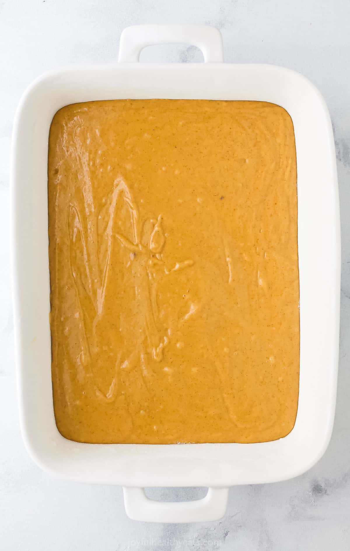 pumpkin coffee cake batter in a baking dish