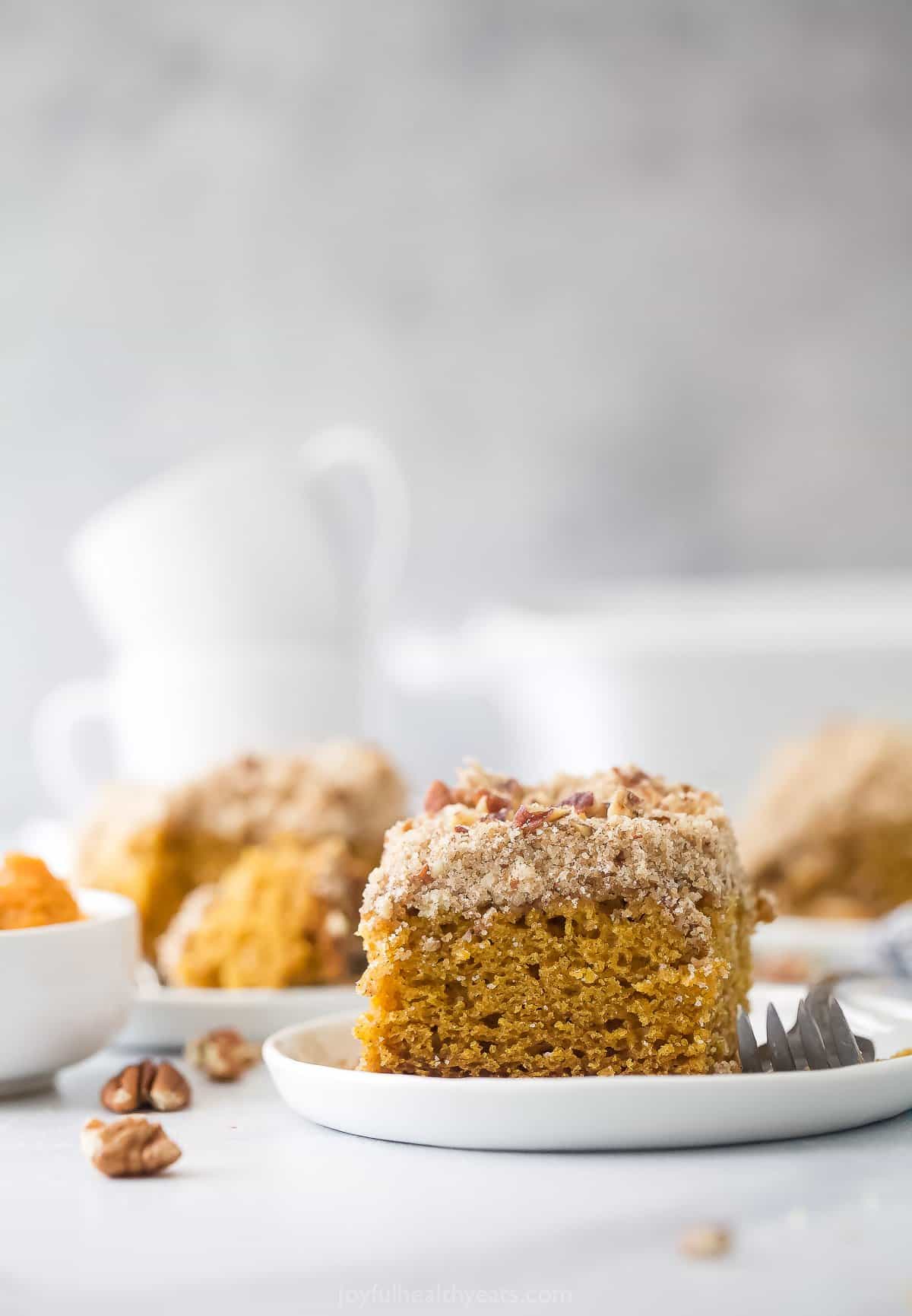 pumpkin spice coffee cake on a plate with a fork
